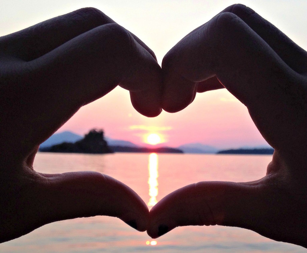 sunset picture, heart fingers